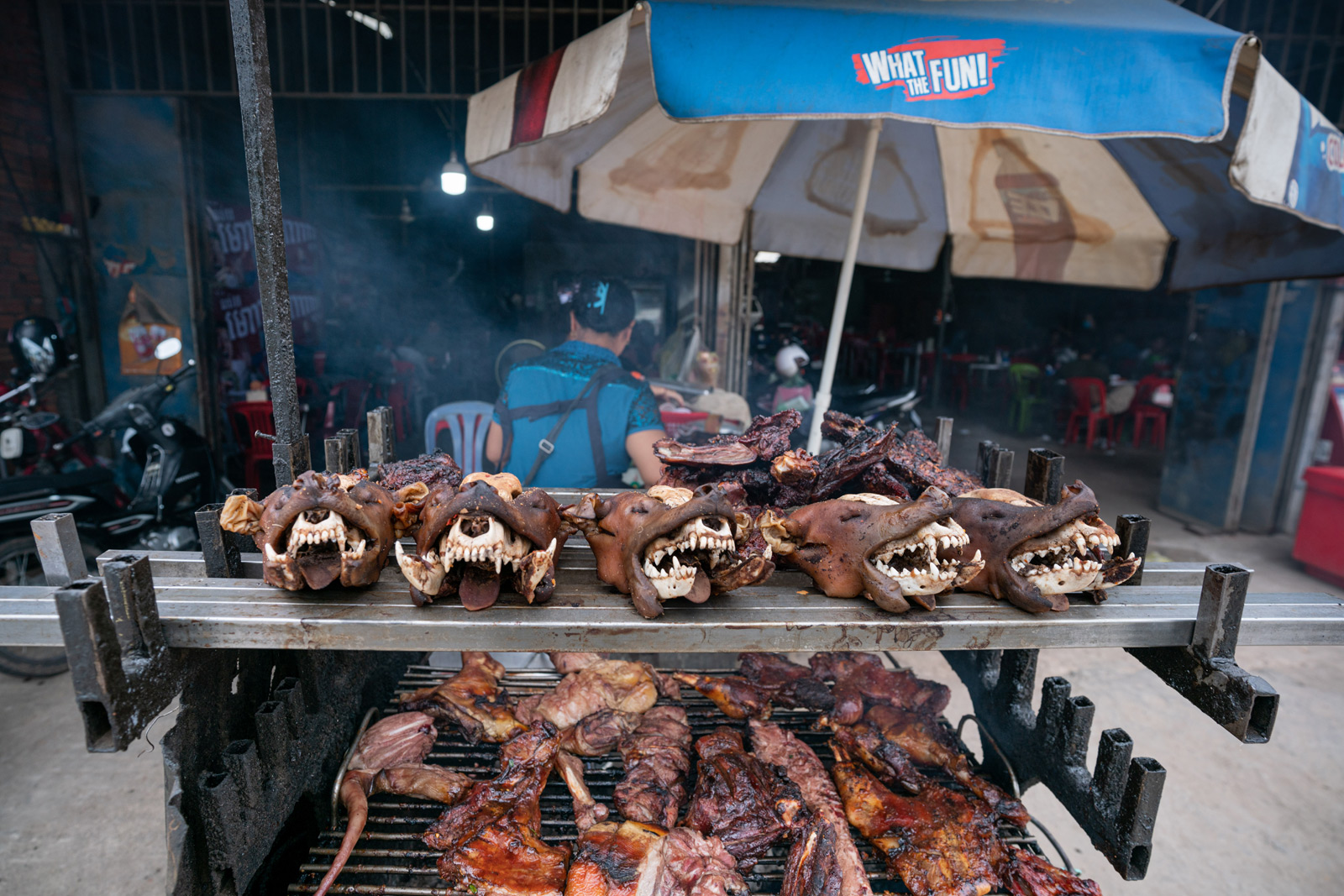 Dog heads and meat for sale in a roadside restaurant in Phnom Penh. Andy Ball