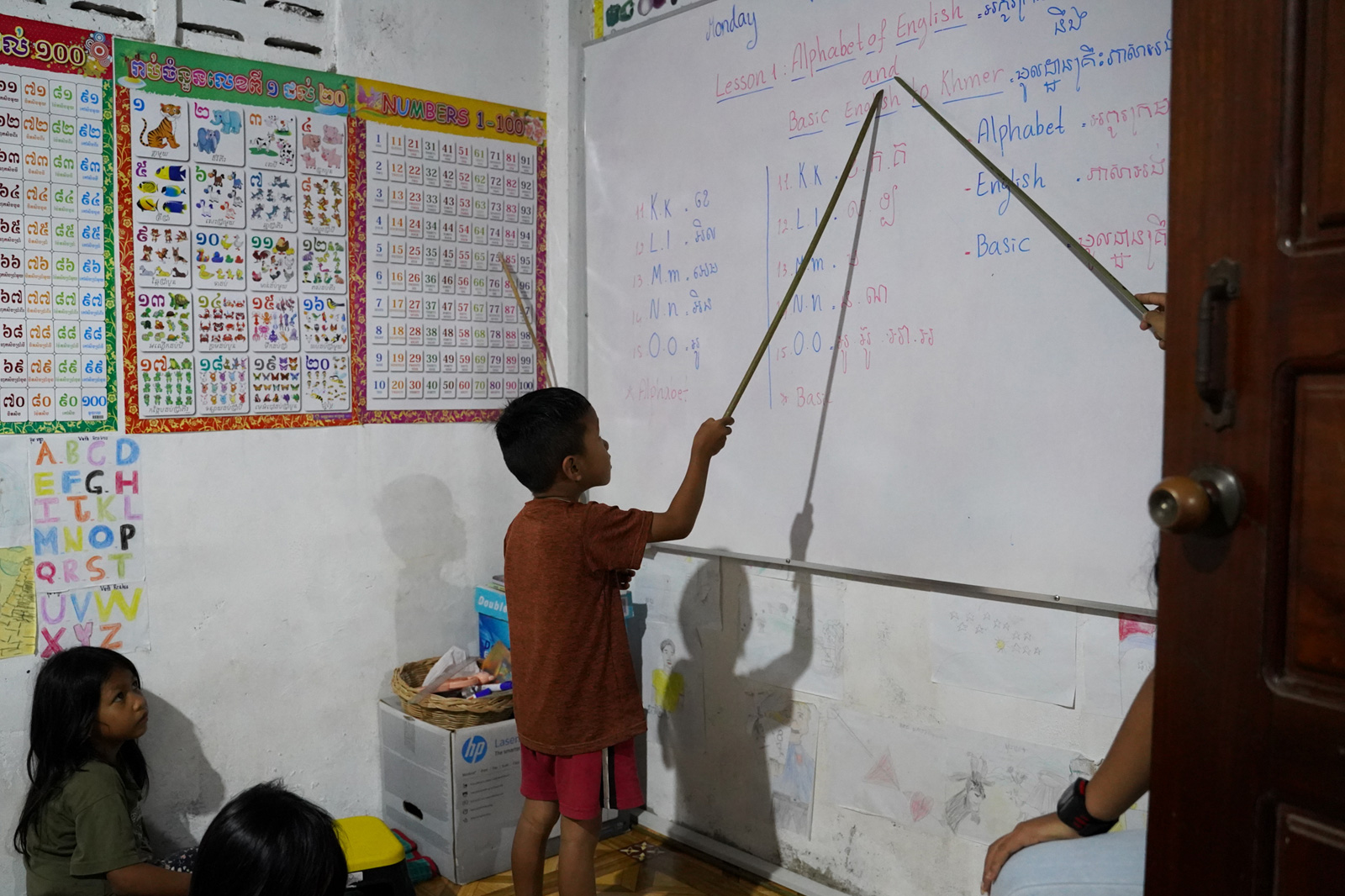 Students are divided into different English classes according to their level at the Village Library in Roha Village.