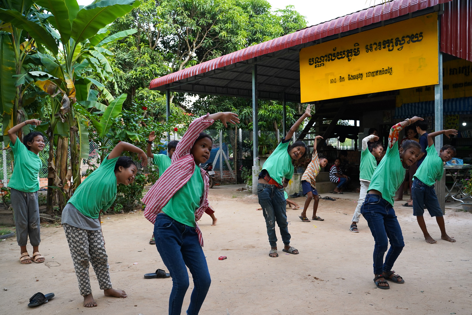 Children come to the Village Library in Areak Svay Village to read, write, draw, exercise and socialise. Students like to wear their green shirts, which were given by a donor, when they come to the library. “It’s like their uniform,” Bopha says.