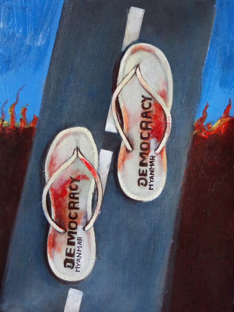 A painting of two bloodied slippers on a tar road. The text 'Democracy Myanmar' is printed on the slippers.