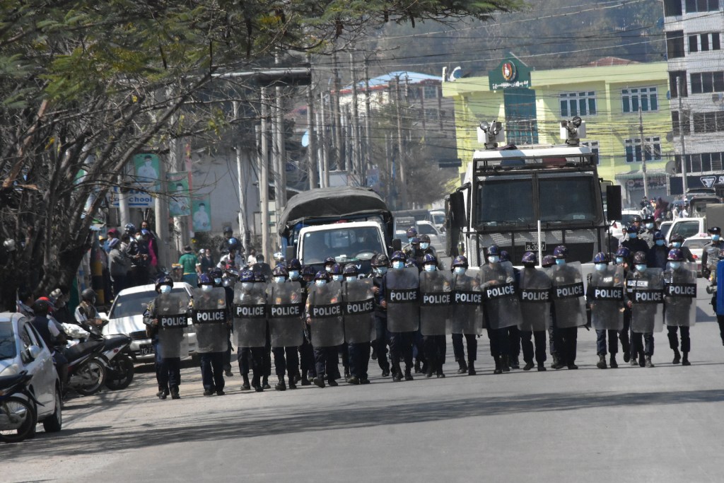 Myanmar security forces line up in formation during anti-coup protests in Taunggyi, Shan State on 10 March 2021.