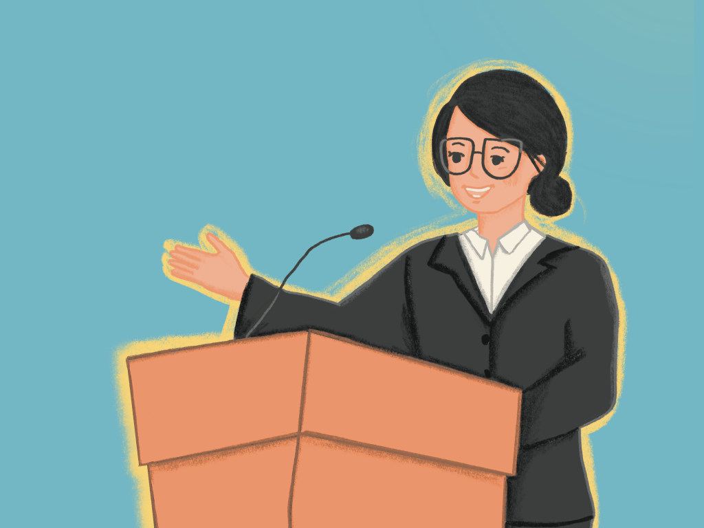 A woman speaking on a podium.
